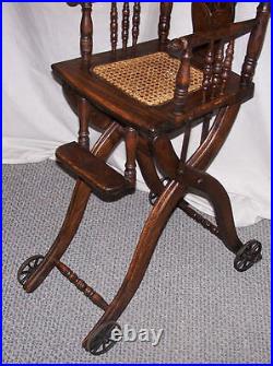 Antique Oak Folding Up and Down High Chair and or Stroller all in one